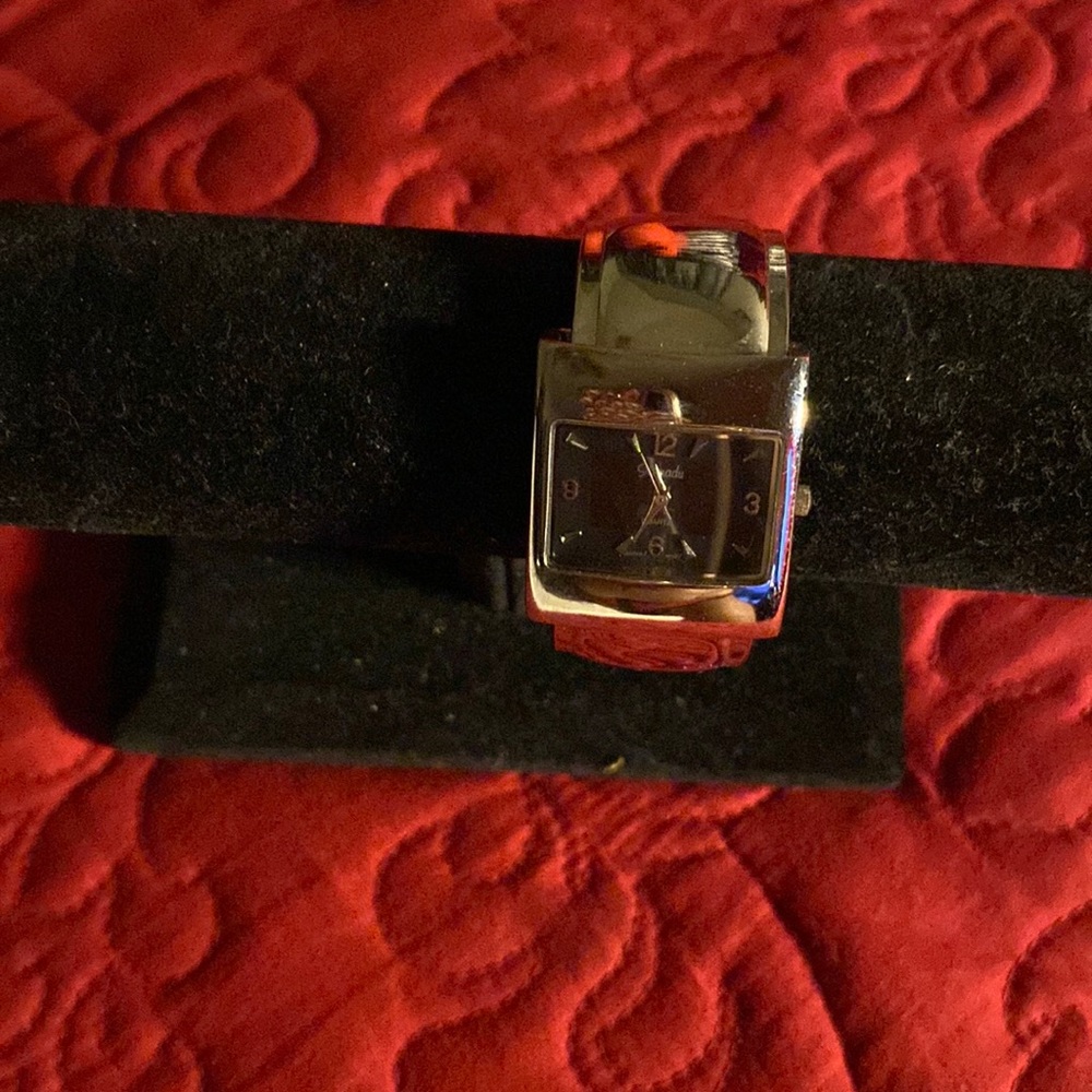 Silver bangle watch